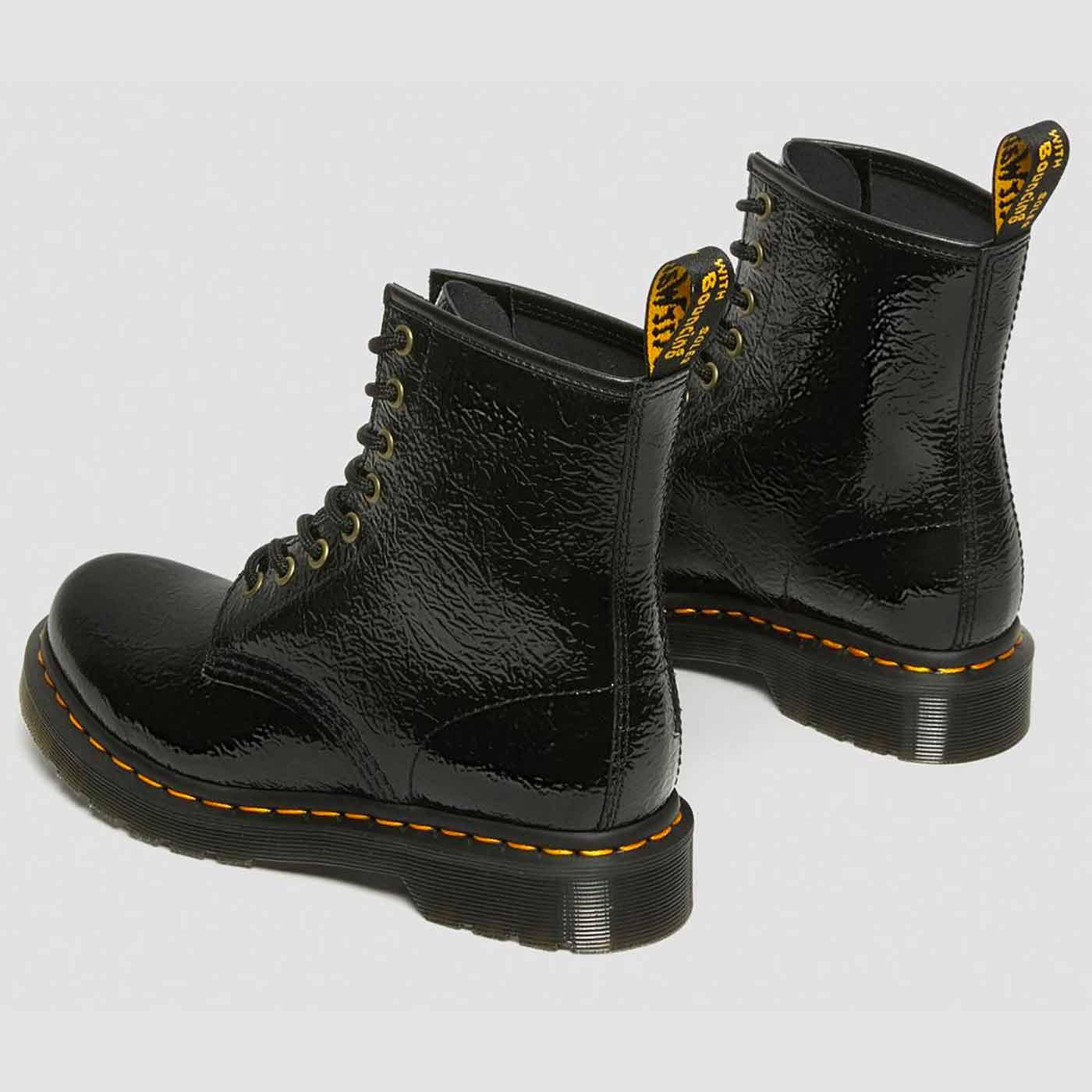 DR MARTENS 1460 Women's Distressed Patent Boots in Black