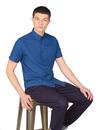 Model sitting wearing Ben Sherman Retro Mod Short Sleeve Classic Oxford Shirt in Airforce Blue